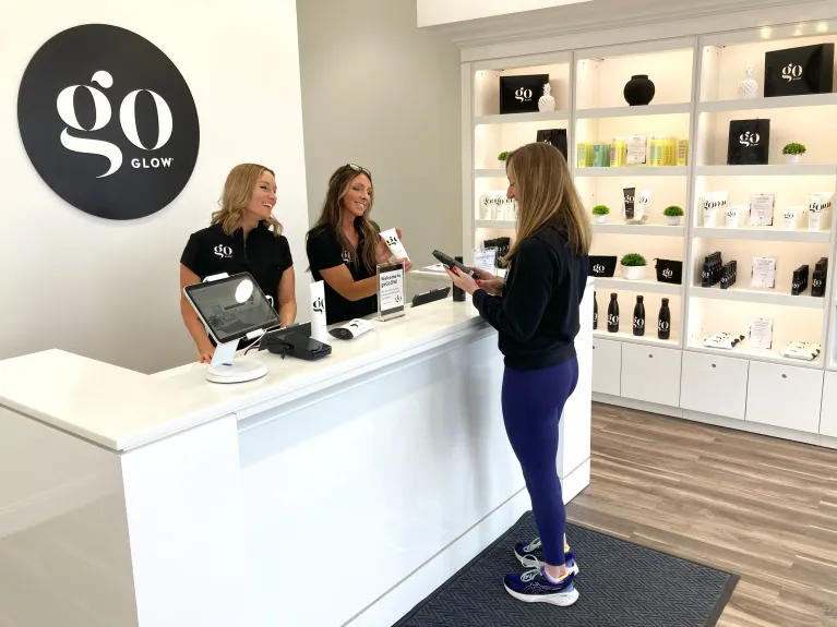 goGLOW store employee selling a product